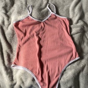 Pink body suit
